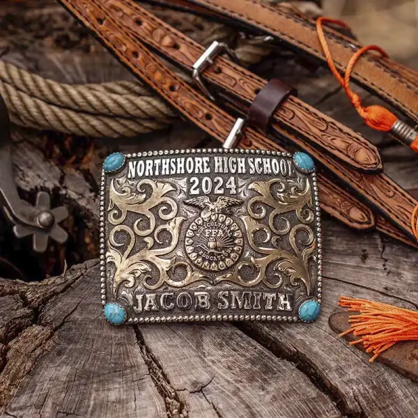A custom belt buckle for Northshore High School with personalized name featuring turquoise stones and the FFA logo